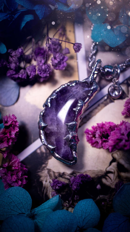 Beautifully bespoke and handcrafted, amethyst, soft soldered moon pendant necklace. This necklace has been handmade using the soft solder method with lead free solder with mix metals including silver. Featuring a gorgeous amethyst moon with stunning patterns. This piece is very unique and comes with its own little cubic zirconia charm. This pendant necklace would be suitable for anyone who loves crystals and jewellery, and that also loves a gothic and witchy vibe! Total soul jewellery
