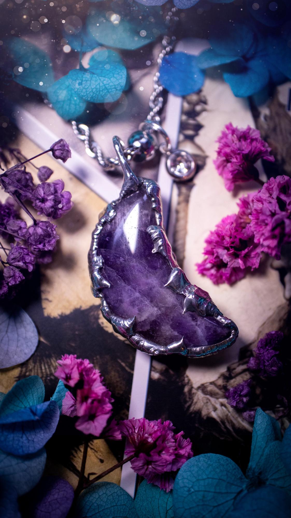 Beautifully bespoke and handcrafted, amethyst, soft soldered moon pendant necklace. This necklace has been handmade using the soft solder method with lead free solder with mix metals including silver. Featuring a gorgeous amethyst moon with stunning patterns. This piece is very unique and comes with its own little cubic zirconia charm. This pendant necklace would be suitable for anyone who loves crystals and jewellery, and that also loves a gothic and witchy vibe! Total soul jewellery