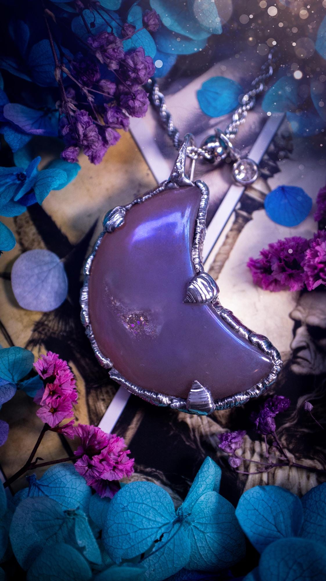 Beautifully bespoke, aurora coated agate, soft soldered moon pendant necklace. This necklace has been handmade using the soft solder method with lead free solder with mix metals including silver. Featuring a gorgeous aurora coated agate moon with a sparkly druzy pocket. This piece is very unique and comes with its own little cubic zirconia charm. This pendant necklace would be suitable for anyone who loves crystals and jewellery, and that also loves a gothic and witchy vibe! Total soul jewellery