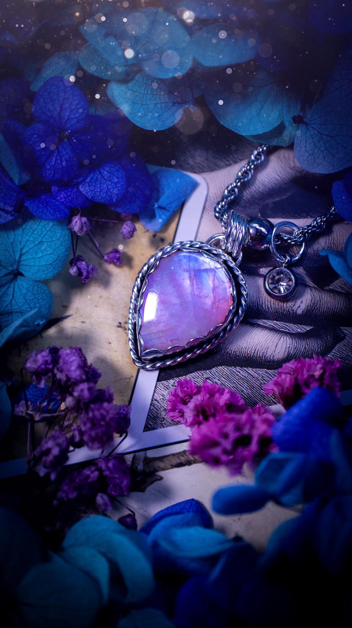 Handmade and bespoke, pink rainbow moonstone, sterling silver pendant necklace. This lovely pendant feature a very high quality rainbow moonstone that is full of gorgeous pink and blue flash. This unusual pink colour has been created by using materials under the stone so the pink hue shines through with the iridescence of the moonstone. Made from fine and sterling silver. An ideal piece for any crystal and jewellery lover. Moonstone is the birthstone for June. Unique gothic jewellery