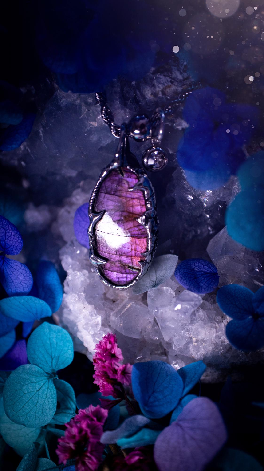 Beautifully handmade and bespoke, purple labradorite, soft soldered pendant necklace. This dainty labradorite pendant has been crafted using the soft solder method, also known as the tiffany technique. The crystal has a bezel of lead free soft solder which contains small parts of silver that allows for oxidisation and a high lustre polish. This labradorite is full of beautiful pinks, purples and has a lovely flash. One off, gothic and witchy jewellery with little claws on the bezel.