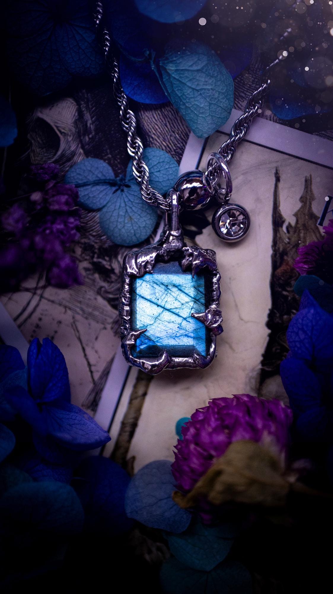 A stunning, and one off pendant necklace. Icy blue labradorite with a facet cut soft soldered pendant. This piece of jewellery has been handmade and features a very high quality, icy blue, natural labradorite crystal. Made using the soft solder method with lead free solder that contains mixed metals including silver. The piece is then polished to a high lustre. Featuring little claws for that gothic and witchy look. Ideal for any crystal and jewellery lover who would like a one of a kind piece.