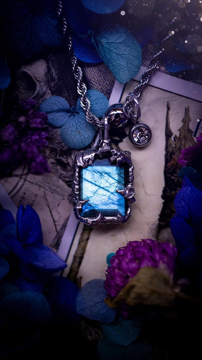 A stunning, and one off pendant necklace. Icy blue labradorite with a facet cut soft soldered pendant. This piece of jewellery has been handmade and features a very high quality, icy blue, natural labradorite crystal. Made using the soft solder method with lead free solder that contains mixed metals including silver. The piece is then polished to a high lustre. Featuring little claws for that gothic and witchy look. Ideal for any crystal and jewellery lover who would like a one of a kind piece.