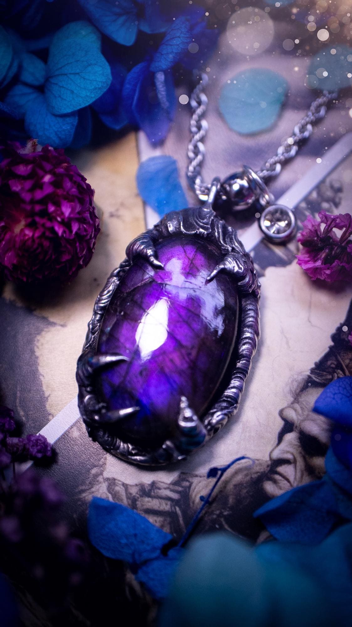 Beautiful and handmade, totally bespoke, purple labradorite pendant necklace. This necklace has been created using the soft solder method with lead free solder for a rustic and gothic look. Featuring a stunning and natural purple blue labradorite crystal. This pendant resembles what I would describe a dragon egg that is being held by the claws off a dragon! Very unique and one off. This piece would make an ideal gift for any crystal or jewellery fan that is into a gothic and witchy vibe!