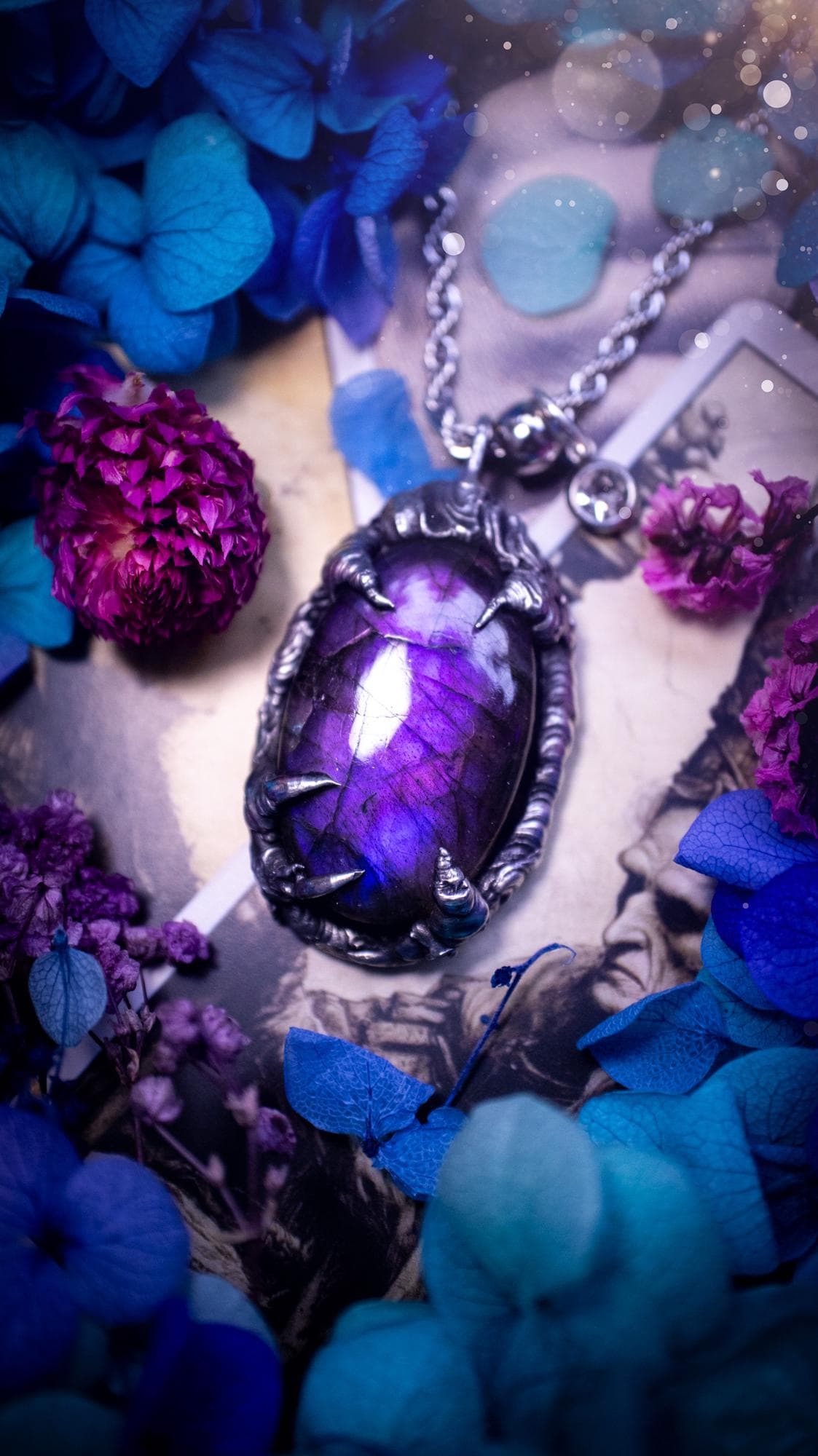 Beautiful and handmade, totally bespoke, purple labradorite pendant necklace. This necklace has been created using the soft solder method with lead free solder for a rustic and gothic look. Featuring a stunning and natural purple blue labradorite crystal. This pendant resembles what I would describe a dragon egg that is being held by the claws off a dragon! Very unique and one off. This piece would make an ideal gift for any crystal or jewellery fan that is into a gothic and witchy vibe!