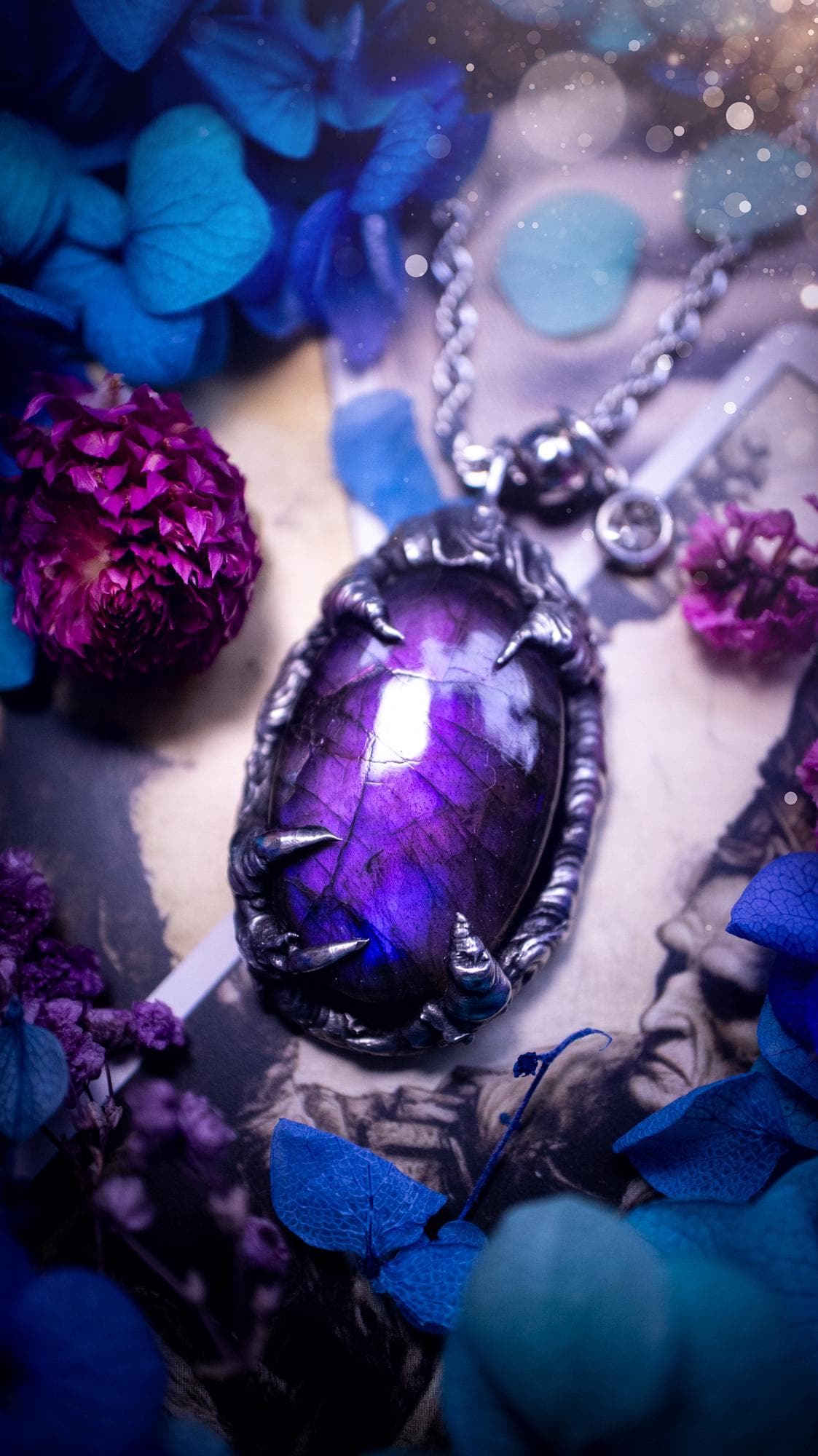 Beautiful and handmade, totally bespoke, purple labradorite pendant necklace. This necklace has been created using the soft solder method with lead free solder for a rustic and gothic look. Featuring a stunning and natural purple blue labradorite crystal. This pendant resembles what I would describe a dragon egg that is being held by the claws off a dragon! Very unique and one off. This piece would make an ideal gift for any crystal or jewellery fan that is into a gothic and witchy vibe!