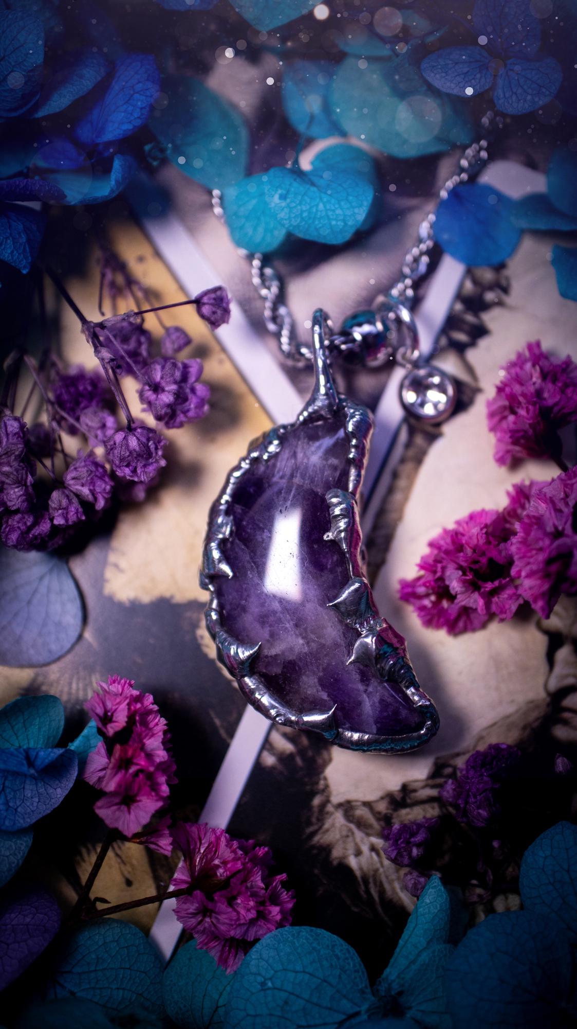 Beautifully bespoke and handcrafted, amethyst, soft soldered moon pendant necklace. This necklace has been handmade using the soft solder method with lead free solder with mix metals including silver. Featuring a gorgeous amethyst moon with stunning patterns. This piece is very unique and comes with its own little cubic zirconia charm. This pendant necklace would be suitable for anyone who loves crystals and jewellery, and that also loves a gothic and witchy vibe! Total soul jewellery