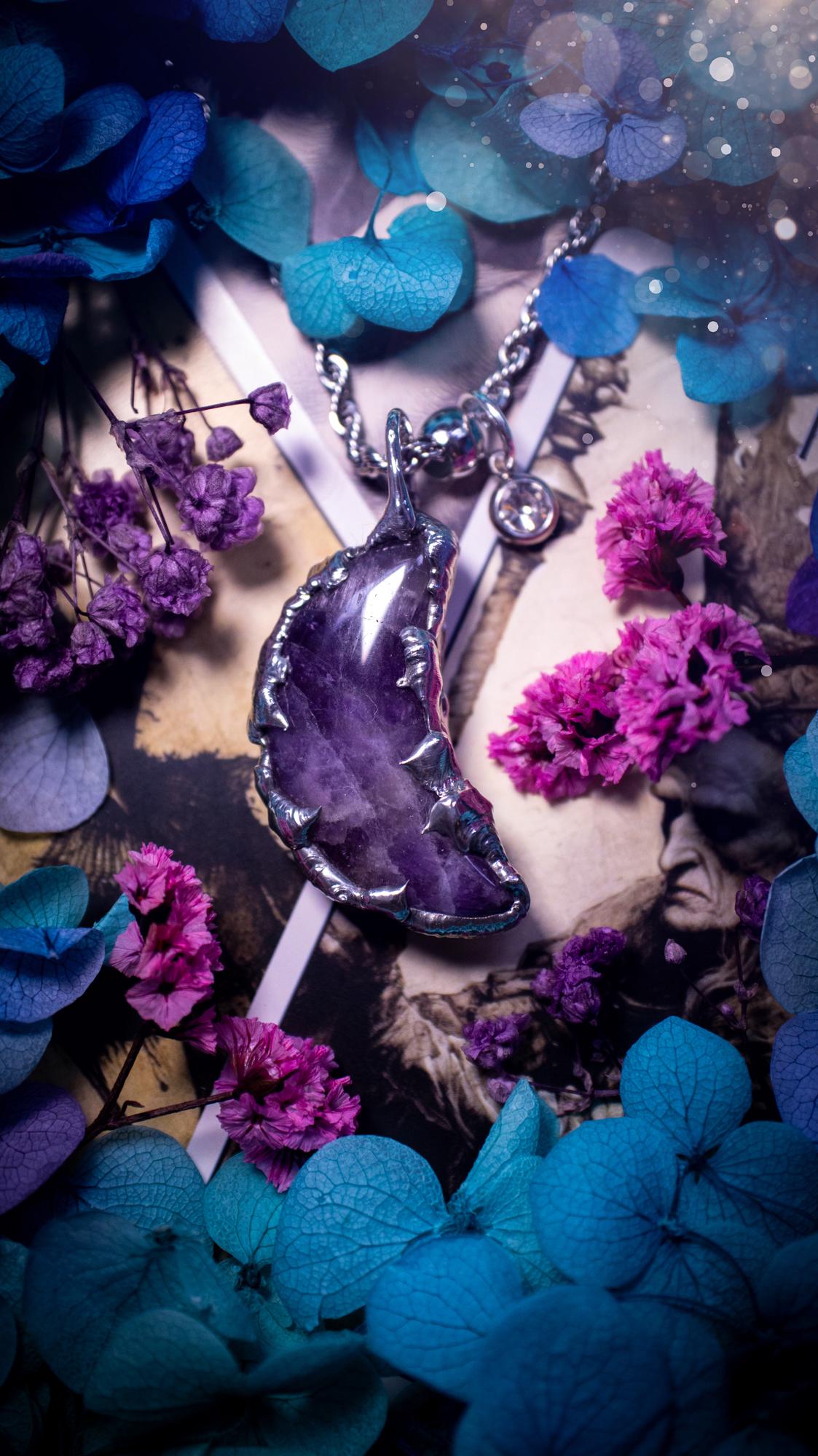 Beautifully bespoke and handcrafted, amethyst, soft soldered moon pendant necklace. This necklace has been handmade using the soft solder method with lead free solder with mix metals including silver. Featuring a gorgeous amethyst moon with stunning patterns. This piece is very unique and comes with its own little cubic zirconia charm. This pendant necklace would be suitable for anyone who loves crystals and jewellery, and that also loves a gothic and witchy vibe! Total soul jewellery