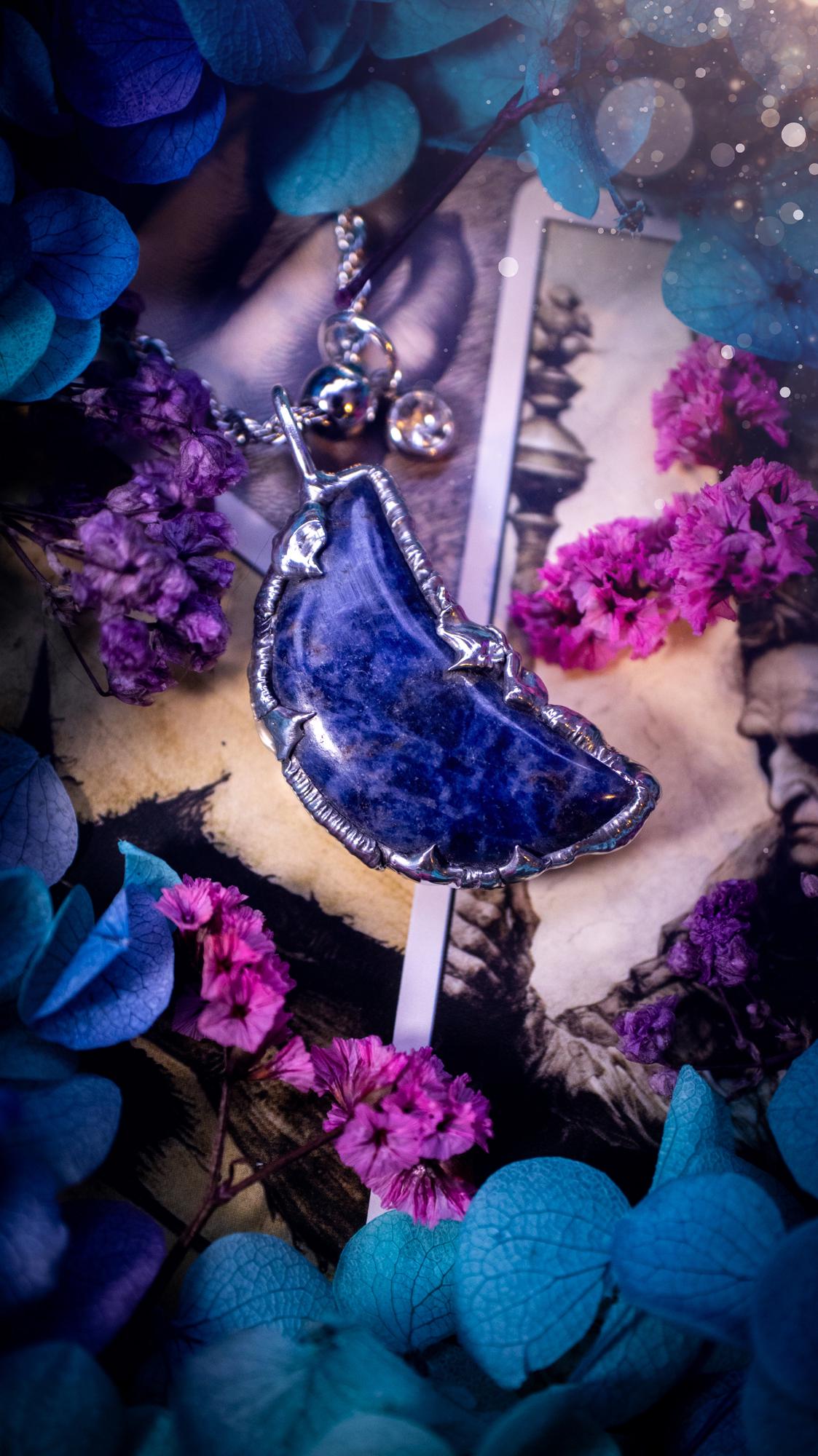 Beautifully bespoke and handcrafted, sodalite, soft soldered moon pendant necklace. This necklace has been handmade using the soft solder method with lead free solder with mix metals including silver. Featuring a gorgeous sodalite moon with stunning patterns. This piece is very unique and comes with its own little cubic zirconia charm. This pendant necklace would be suitable for anyone who loves crystals and jewellery, and that also loves a gothic and witchy vibe! Total soul jewellery