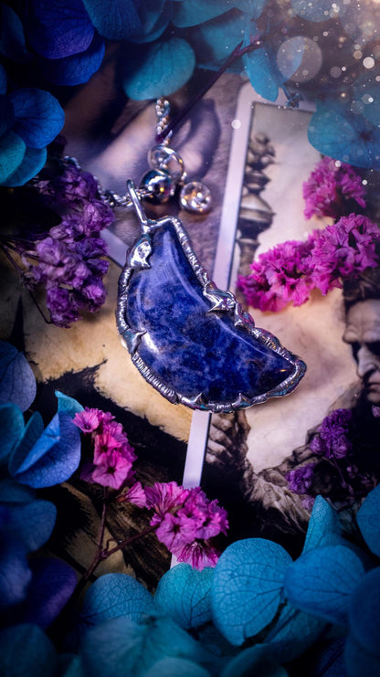 Beautifully bespoke and handcrafted, sodalite, soft soldered moon pendant necklace. This necklace has been handmade using the soft solder method with lead free solder with mix metals including silver. Featuring a gorgeous sodalite moon with stunning patterns. This piece is very unique and comes with its own little cubic zirconia charm. This pendant necklace would be suitable for anyone who loves crystals and jewellery, and that also loves a gothic and witchy vibe! Total soul jewellery
