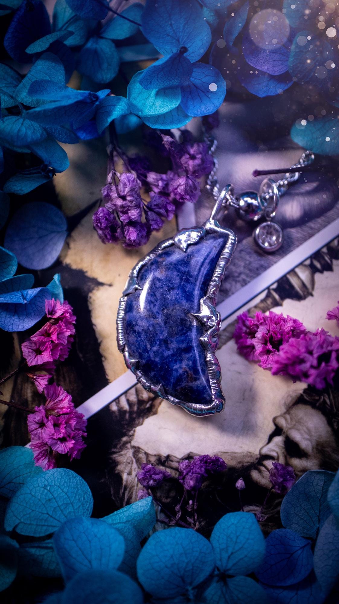 Beautifully bespoke and handcrafted, sodalite, soft soldered moon pendant necklace. This necklace has been handmade using the soft solder method with lead free solder with mix metals including silver. Featuring a gorgeous sodalite moon with stunning patterns. This piece is very unique and comes with its own little cubic zirconia charm. This pendant necklace would be suitable for anyone who loves crystals and jewellery, and that also loves a gothic and witchy vibe! Total soul jewellery