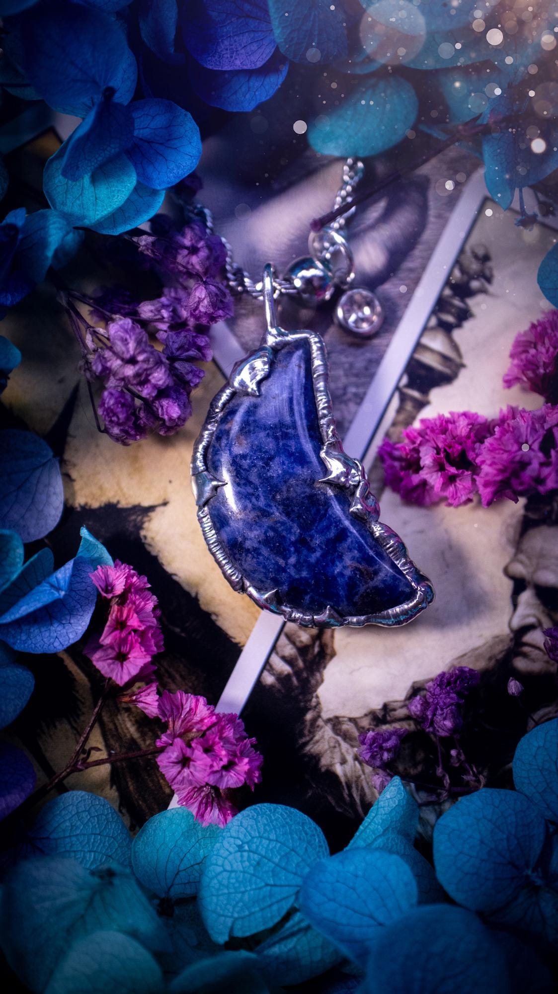 Beautifully bespoke and handcrafted, sodalite, soft soldered moon pendant necklace. This necklace has been handmade using the soft solder method with lead free solder with mix metals including silver. Featuring a gorgeous sodalite moon with stunning patterns. This piece is very unique and comes with its own little cubic zirconia charm. This pendant necklace would be suitable for anyone who loves crystals and jewellery, and that also loves a gothic and witchy vibe! Total soul jewellery