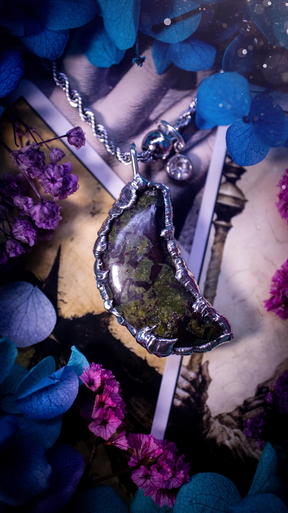 Beautifully bespoke and handcrafted, blood stone, soft soldered moon pendant necklace. This necklace has been handmade using the soft solder method with lead free solder with mix metals including silver. Featuring a gorgeous blood stone moon with stunning patterns. This piece is very unique and comes with its own little cubic zirconia charm. This pendant necklace would be suitable for anyone who loves crystals and jewellery, and that also loves a gothic and witchy vibe! Total soul jewellery