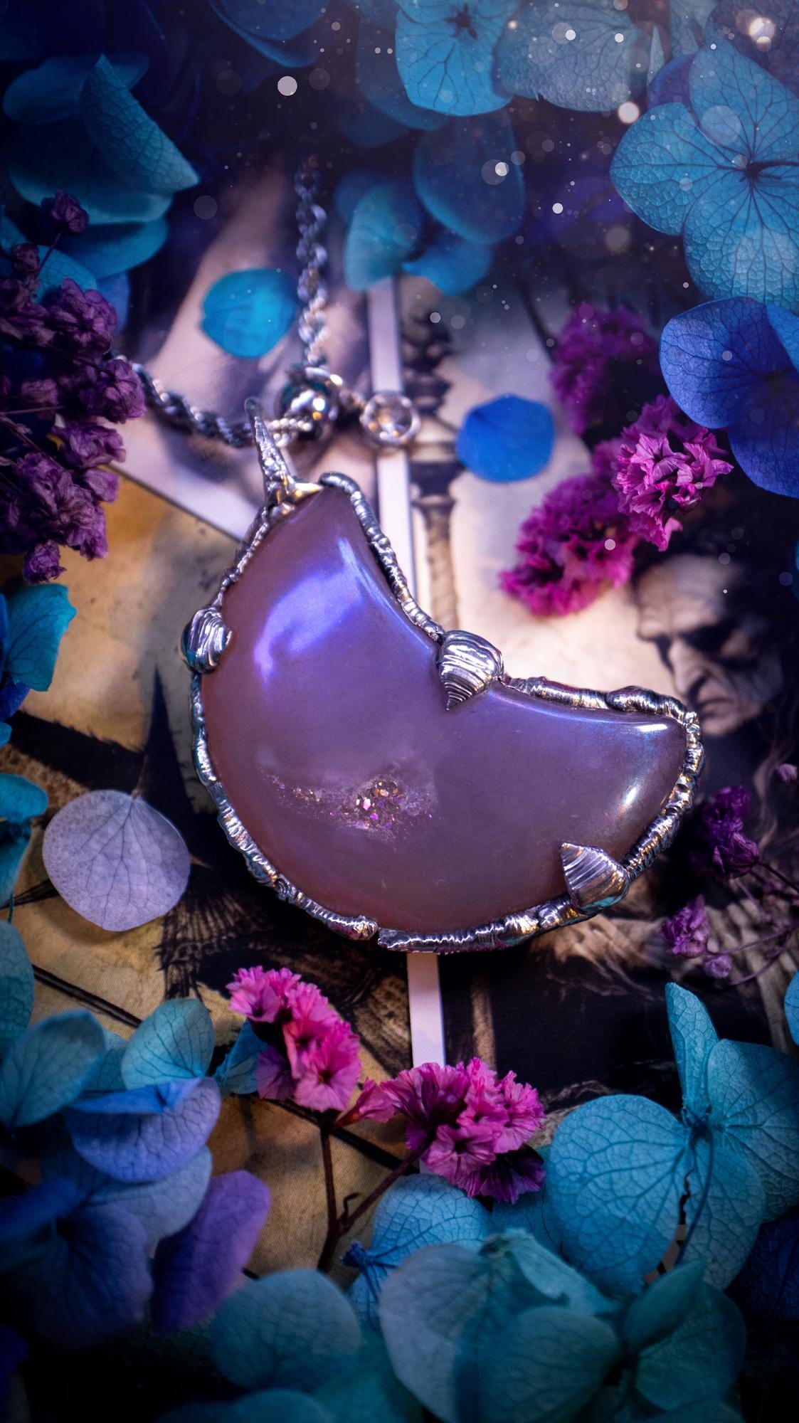 Beautifully bespoke, aurora coated agate, soft soldered moon pendant necklace. This necklace has been handmade using the soft solder method with lead free solder with mix metals including silver. Featuring a gorgeous aurora coated agate moon with a sparkly druzy pocket. This piece is very unique and comes with its own little cubic zirconia charm. This pendant necklace would be suitable for anyone who loves crystals and jewellery, and that also loves a gothic and witchy vibe! Total soul jewellery