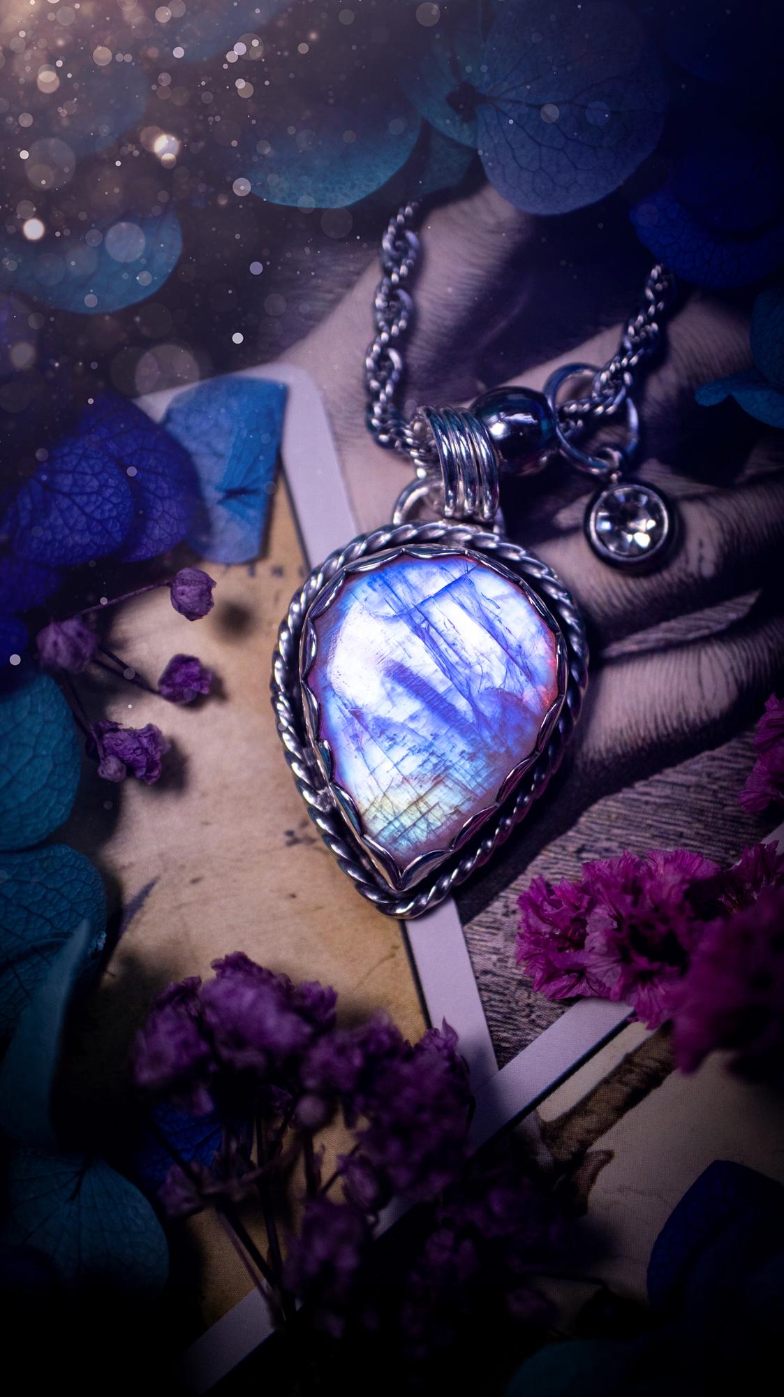 Handmade and bespoke, pink rainbow moonstone, sterling silver pendant necklace. This lovely pendant feature a very high quality rainbow moonstone that is full of gorgeous pink and blue flash. This unusual pink colour has been created by using materials under the stone so the pink hue shines through with the iridescence of the moonstone. Made from fine and sterling silver. An ideal piece for any crystal and jewellery lover. Moonstone is the birthstone for June. Unique gothic jewellery