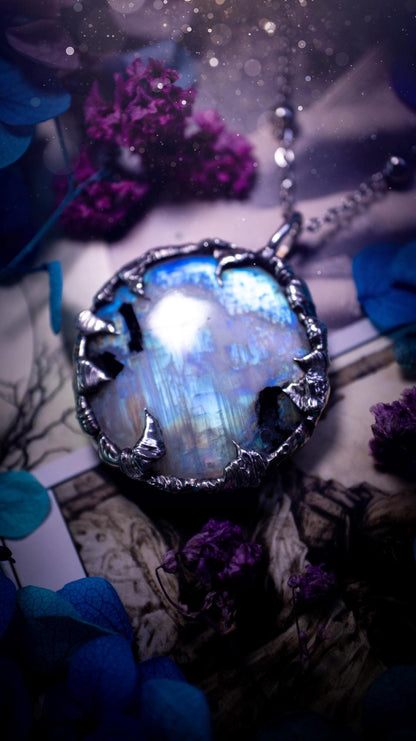 Handmade and beautiful, flashy rainbow moonstone, soft soldered pendant necklace. This pendant necklace features the most gorgeous and flashy moonstone crystal, full of glittery shimmer and a deep lovely blue hue. Handcrafted using the soft solder method, also known as the tiffany technique, an ancient technique used to created stained glass windows. The solder used is lead free and totally safe to wear, it contains elements of silver and polishes up to a high lustre. Gothic witchy jewellery