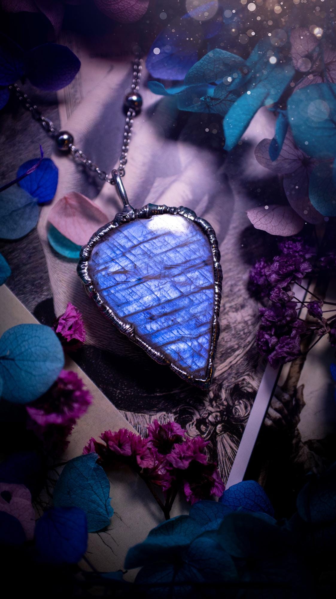 Handmade and beautiful, flashy belomorite, soft soldered pendant necklace. This pendant necklace features the most gorgeous and flashy belomorite moonstone crystal, full of glittery shimmer and a deep lovely blue hue. Handcrafted using the soft solder method, also known as the tiffany technique, an ancient technique used to created stained glass windows. The solder used is lead free and totally safe to wear, it contains elements of silver and polishes up to a high lustre. Gothic witchy jewellery