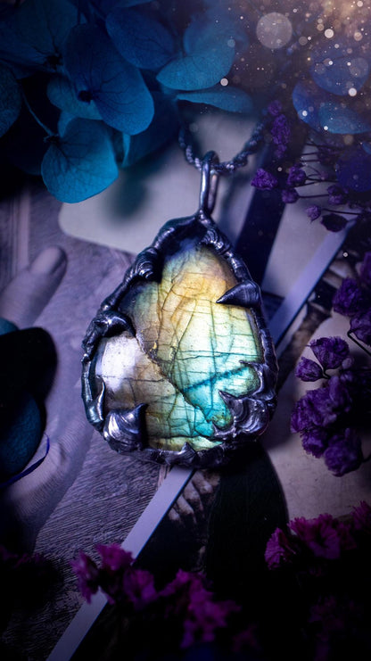 Beautiful, handmade and totally bespoke, green and blue, labradorite crystal, pendant necklace. This jewellery piece has been handcrafted using the soft solder method, using lead free solder that contains silver, then oxidised to create a gothic mystical look. Featuring a beautiful multi flash labradorite crystal with the flash shifting from green to blue. A lovely piece ideal for anyone who loves crystals and jewellery. This is a one of a kind piece with no other the same, gothic design
