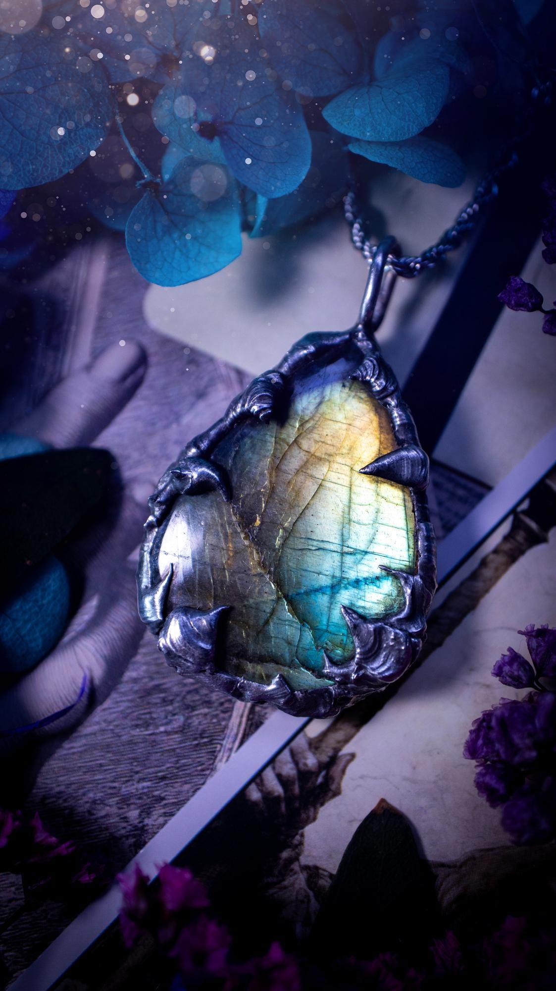 Beautiful, handmade and totally bespoke, green and blue, labradorite crystal, pendant necklace. This jewellery piece has been handcrafted using the soft solder method, using lead free solder that contains silver, then oxidised to create a gothic mystical look. Featuring a beautiful multi flash labradorite crystal with the flash shifting from green to blue. A lovely piece ideal for anyone who loves crystals and jewellery. This is a one of a kind piece with no other the same, gothic design