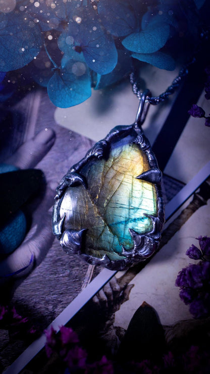 Beautiful, handmade and totally bespoke, green and blue, labradorite crystal, pendant necklace. This jewellery piece has been handcrafted using the soft solder method, using lead free solder that contains silver, then oxidised to create a gothic mystical look. Featuring a beautiful multi flash labradorite crystal with the flash shifting from green to blue. A lovely piece ideal for anyone who loves crystals and jewellery. This is a one of a kind piece with no other the same, gothic design