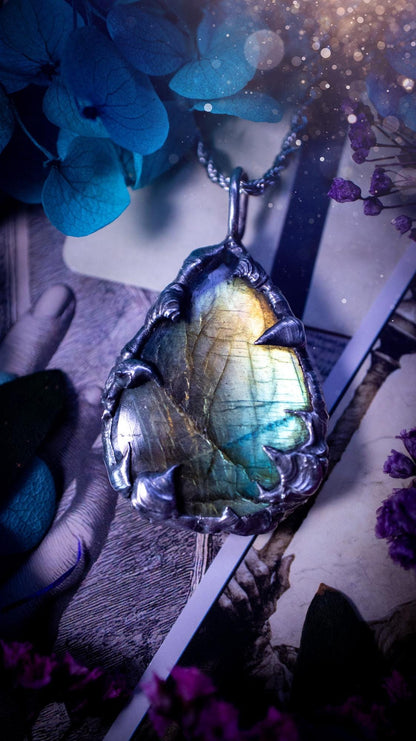 Beautiful, handmade and totally bespoke, green and blue, labradorite crystal, pendant necklace. This jewellery piece has been handcrafted using the soft solder method, using lead free solder that contains silver, then oxidised to create a gothic mystical look. Featuring a beautiful multi flash labradorite crystal with the flash shifting from green to blue. A lovely piece ideal for anyone who loves crystals and jewellery. This is a one of a kind piece with no other the same, gothic design