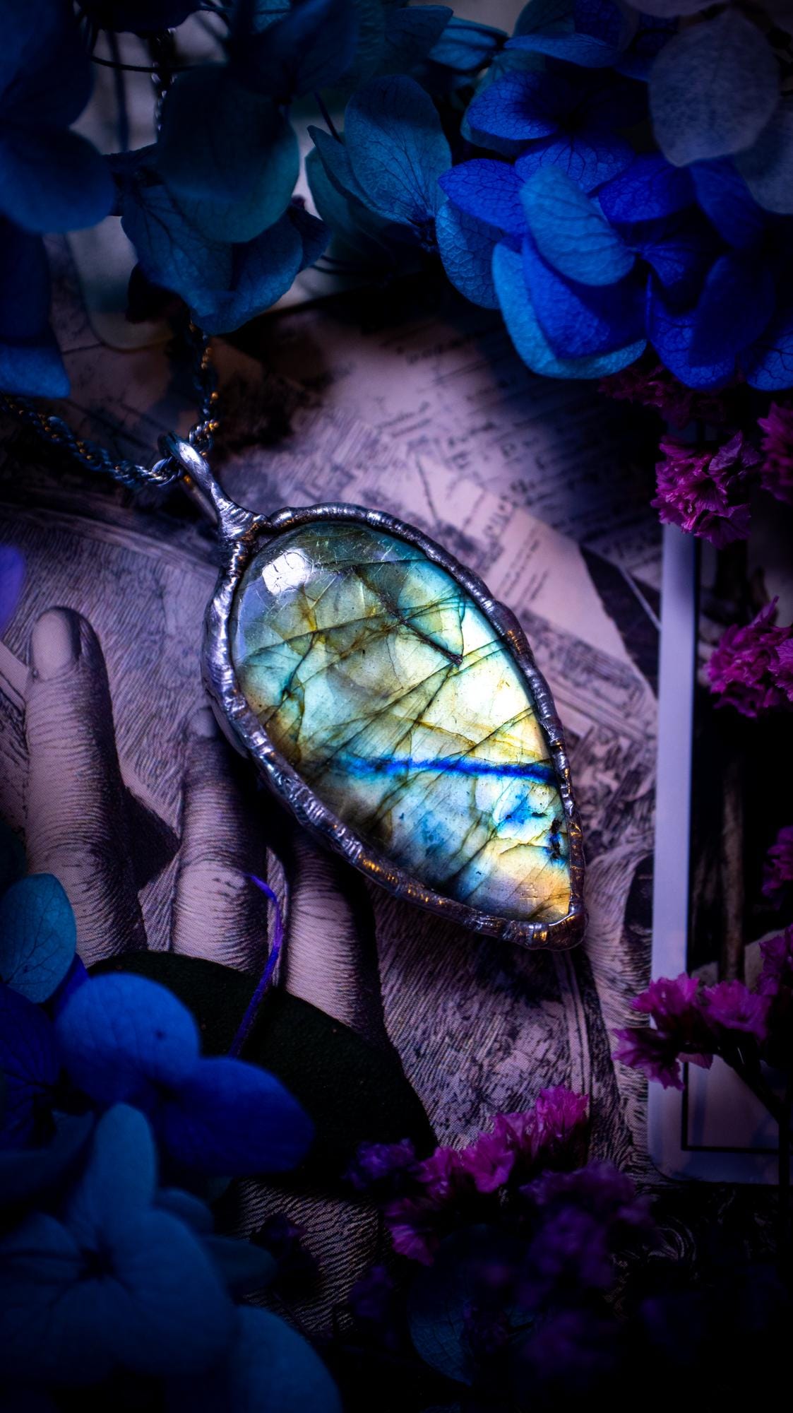 Beautiful, handmade and totally bespoke, green and blue, labradorite crystal, pendant necklace. This jewellery piece has been handcrafted using the soft solder method, using lead free solder that contains silver, then oxidised to create a gothic mystical look. Featuring a beautiful multi flash labradorite crystal with the flash shifting from green to blue. A lovely piece ideal for anyone who loves crystals and jewellery. This is a one of a kind piece with no other the same, gothic design