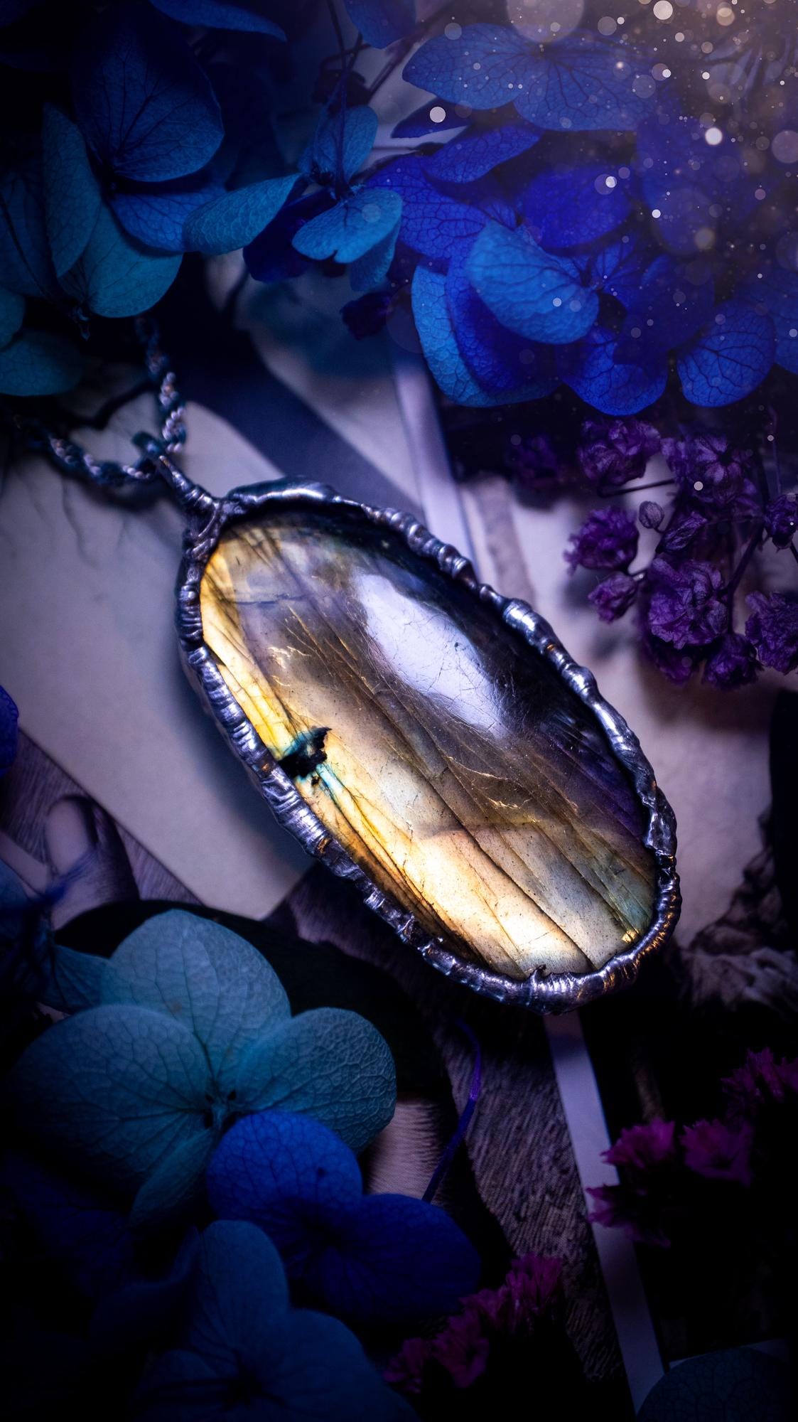 Beautiful, handmade and totally bespoke, orange and yellow, labradorite crystal, pendant necklace. This jewellery piece has been handcrafted using the soft solder method, using lead free solder that contains silver, then oxidised to create a gothic mystical look. Featuring a beautiful multi flash labradorite crystal with the flash shifting from yellow to orange. A lovely piece ideal for anyone who loves crystals and jewellery. This is a one of a kind piece with no other the same, gothic design