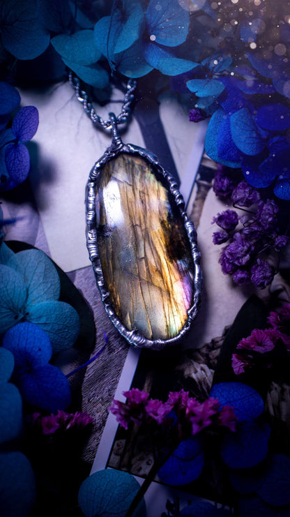 Beautiful, handmade and totally bespoke, orange and yellow, labradorite crystal, pendant necklace. This jewellery piece has been handcrafted using the soft solder method, using lead free solder that contains silver, then oxidised to create a gothic mystical look. Featuring a beautiful multi flash labradorite crystal with the flash shifting from yellow to orange. A lovely piece ideal for anyone who loves crystals and jewellery. This is a one of a kind piece with no other the same, gothic design