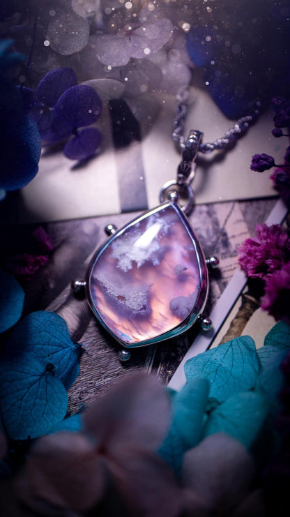Beautifully handmade, aurora opal doublet and plume agate crystal pendant necklace. This necklace has been made from a mixed of fine and sterling silver. Featuring a stunning and unusual Aurora opal and plume agate doublet that has little tiny druzys, full of beautiful pattern and a glowing pink essence. Around the smooth bezel is some cute little ball details. This piece of jewellery would be ideal for any crystal and jewellery lover how loves unique and alternative pieces! Ideal for gifting