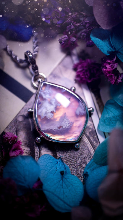 Beautifully handmade, aurora opal doublet and plume agate crystal pendant necklace. This necklace has been made from a mixed of fine and sterling silver. Featuring a stunning and unusual Aurora opal and plume agate doublet that has little tiny druzys, full of beautiful pattern and a glowing pink essence. Around the smooth bezel is some cute little ball details. This piece of jewellery would be ideal for any crystal and jewellery lover how loves unique and alternative pieces! Ideal for gifting