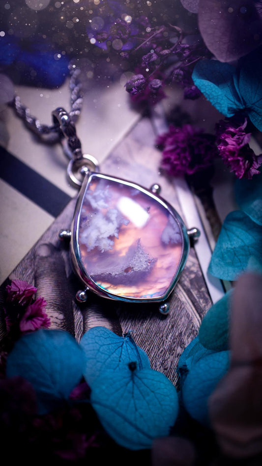 Beautifully handmade, aurora opal doublet and plume agate crystal pendant necklace. This necklace has been made from a mixed of fine and sterling silver. Featuring a stunning and unusual Aurora opal and plume agate doublet that has little tiny druzys, full of beautiful pattern and a glowing pink essence. Around the smooth bezel is some cute little ball details. This piece of jewellery would be ideal for any crystal and jewellery lover how loves unique and alternative pieces! Ideal for gifting