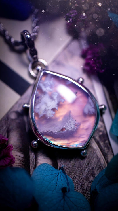 Beautifully handmade, aurora opal doublet and plume agate crystal pendant necklace. This necklace has been made from a mixed of fine and sterling silver. Featuring a stunning and unusual Aurora opal and plume agate doublet that has little tiny druzys, full of beautiful pattern and a glowing pink essence. Around the smooth bezel is some cute little ball details. This piece of jewellery would be ideal for any crystal and jewellery lover how loves unique and alternative pieces! Ideal for gifting