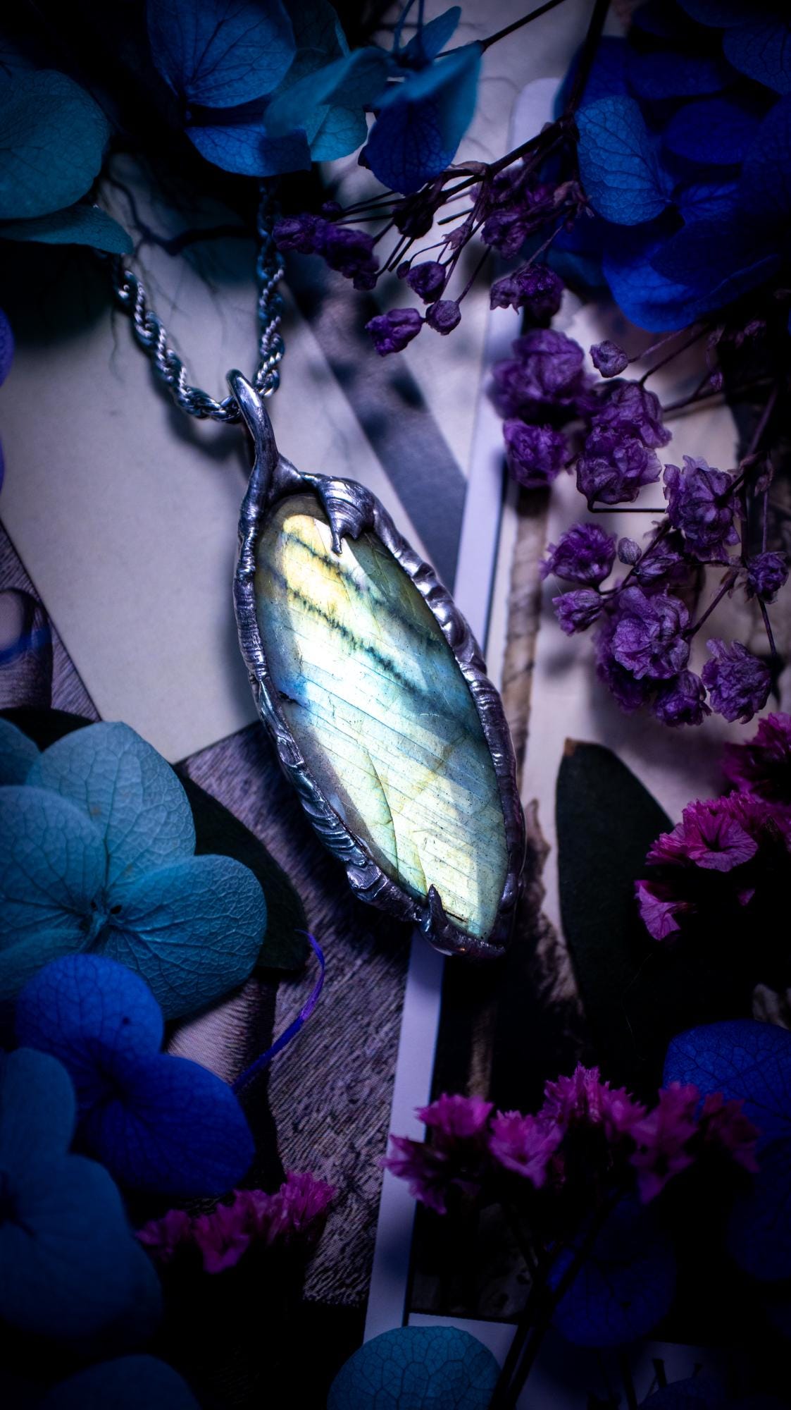 Beautiful, handmade and totally bespoke, green and blue, labradorite crystal, pendant necklace. This jewellery piece has been handcrafted using the soft solder method, using lead free solder that contains silver, then oxidised to create a gothic mystical look. Featuring a beautiful multi flash labradorite crystal with the flash shifting from green to blue. A lovely piece ideal for anyone who loves crystals and jewellery. This is a one of a kind piece with no other the same, gothic design