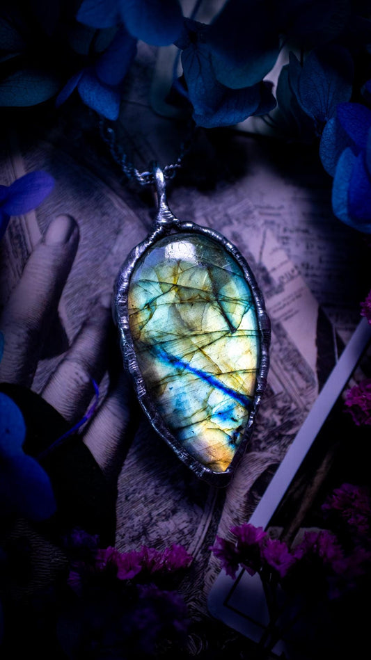 Beautiful, handmade and totally bespoke, green and blue, labradorite crystal, pendant necklace. This jewellery piece has been handcrafted using the soft solder method, using lead free solder that contains silver, then oxidised to create a gothic mystical look. Featuring a beautiful multi flash labradorite crystal with the flash shifting from green to blue. A lovely piece ideal for anyone who loves crystals and jewellery. This is a one of a kind piece with no other the same, gothic design