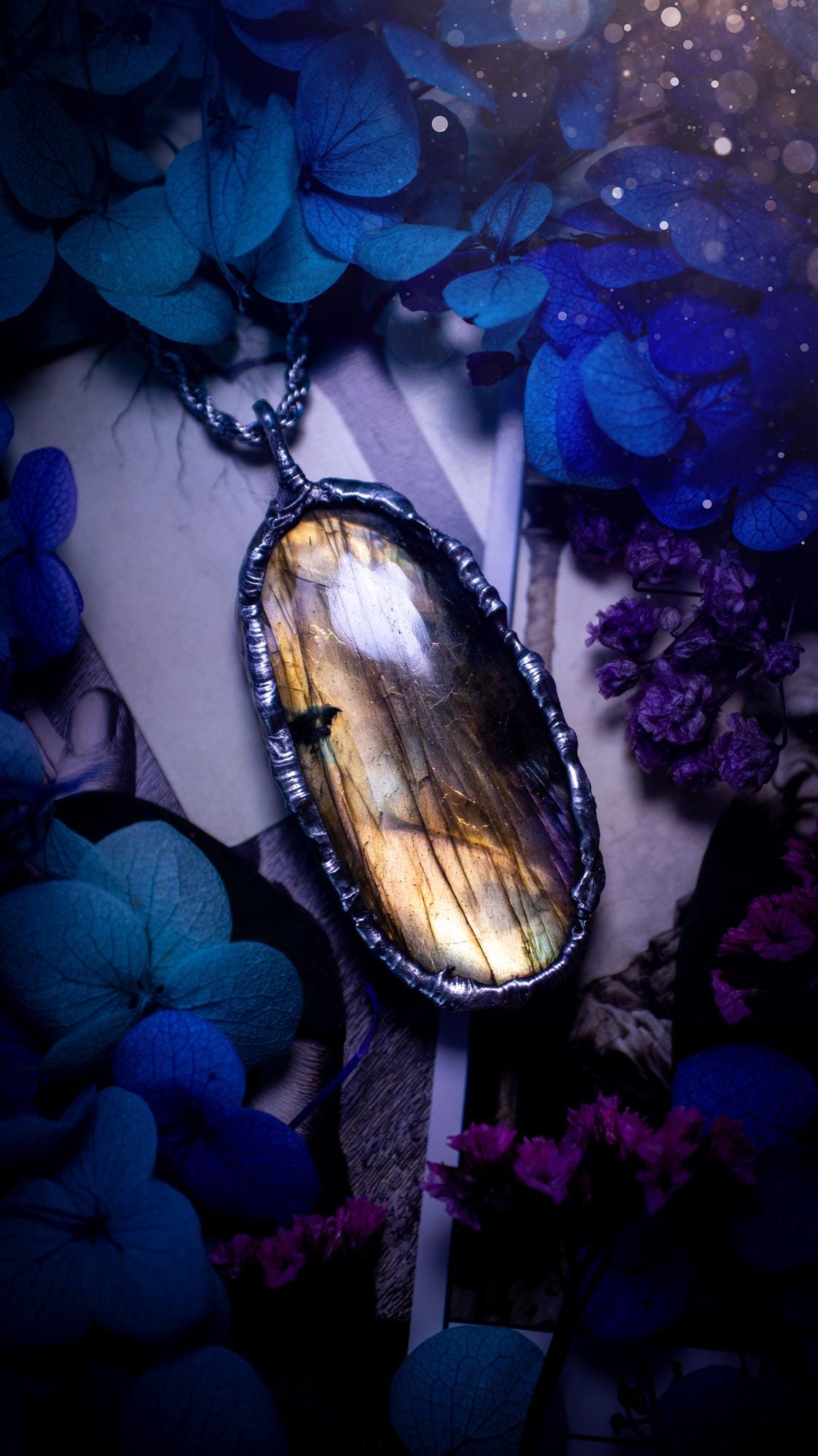 Beautiful, handmade and totally bespoke, orange and yellow, labradorite crystal, pendant necklace. This jewellery piece has been handcrafted using the soft solder method, using lead free solder that contains silver, then oxidised to create a gothic mystical look. Featuring a beautiful multi flash labradorite crystal with the flash shifting from yellow to orange. A lovely piece ideal for anyone who loves crystals and jewellery. This is a one of a kind piece with no other the same, gothic design