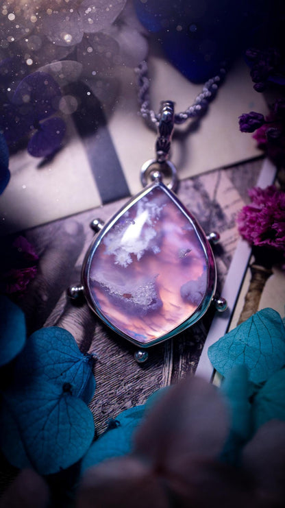 Beautifully handmade, aurora opal doublet and plume agate crystal pendant necklace. This necklace has been made from a mixed of fine and sterling silver. Featuring a stunning and unusual Aurora opal and plume agate doublet that has little tiny druzys, full of beautiful pattern and a glowing pink essence. Around the smooth bezel is some cute little ball details. This piece of jewellery would be ideal for any crystal and jewellery lover how loves unique and alternative pieces! Ideal for gifting