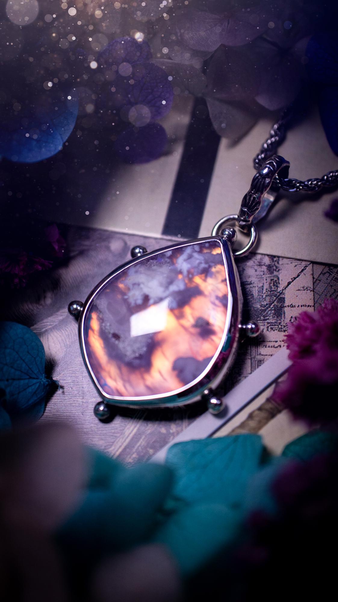 Beautifully handmade, aurora opal doublet and plume agate crystal pendant necklace. This necklace has been made from a mixed of fine and sterling silver. Featuring a stunning and unusual Aurora opal and plume agate doublet that has little tiny druzys, full of beautiful pattern and a glowing pink essence. Around the smooth bezel is some cute little ball details. This piece of jewellery would be ideal for any crystal and jewellery lover how loves unique and alternative pieces! Ideal for gifting