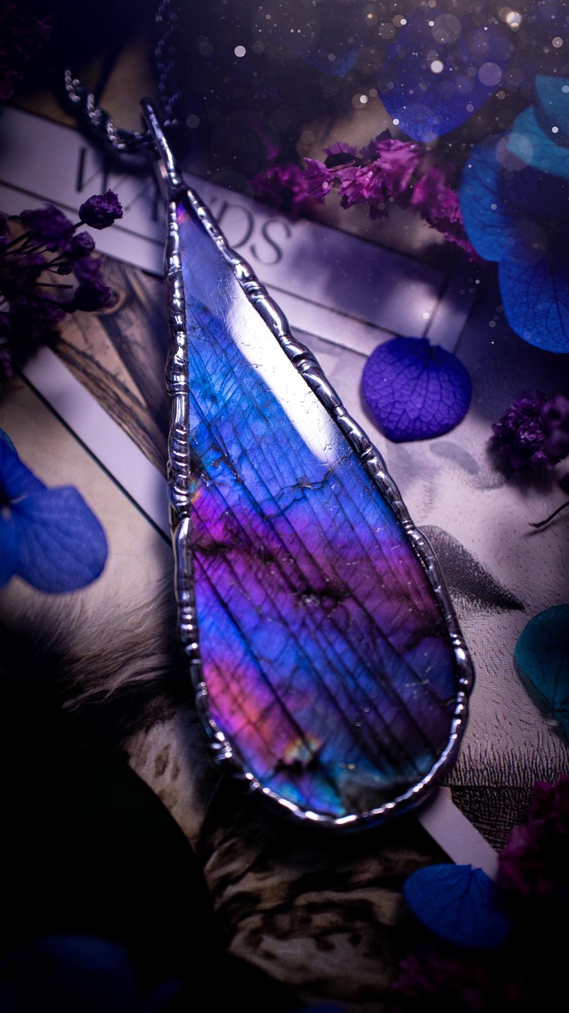 Beautiful and bold, soft soldered, large and very unique Labradorite pendant necklace. This pendant necklace has been handmade using the soft solder method, using lead free solder that contains silver and polished to a high lustre. Featuring a large, very pretty statement Labradorite crystal that is full of beautiful purples, pinks, and blues, with different flashes from different angles. This piece would but suitable for anyone who loves jewellery, crystals, and a gothic aesthetic.