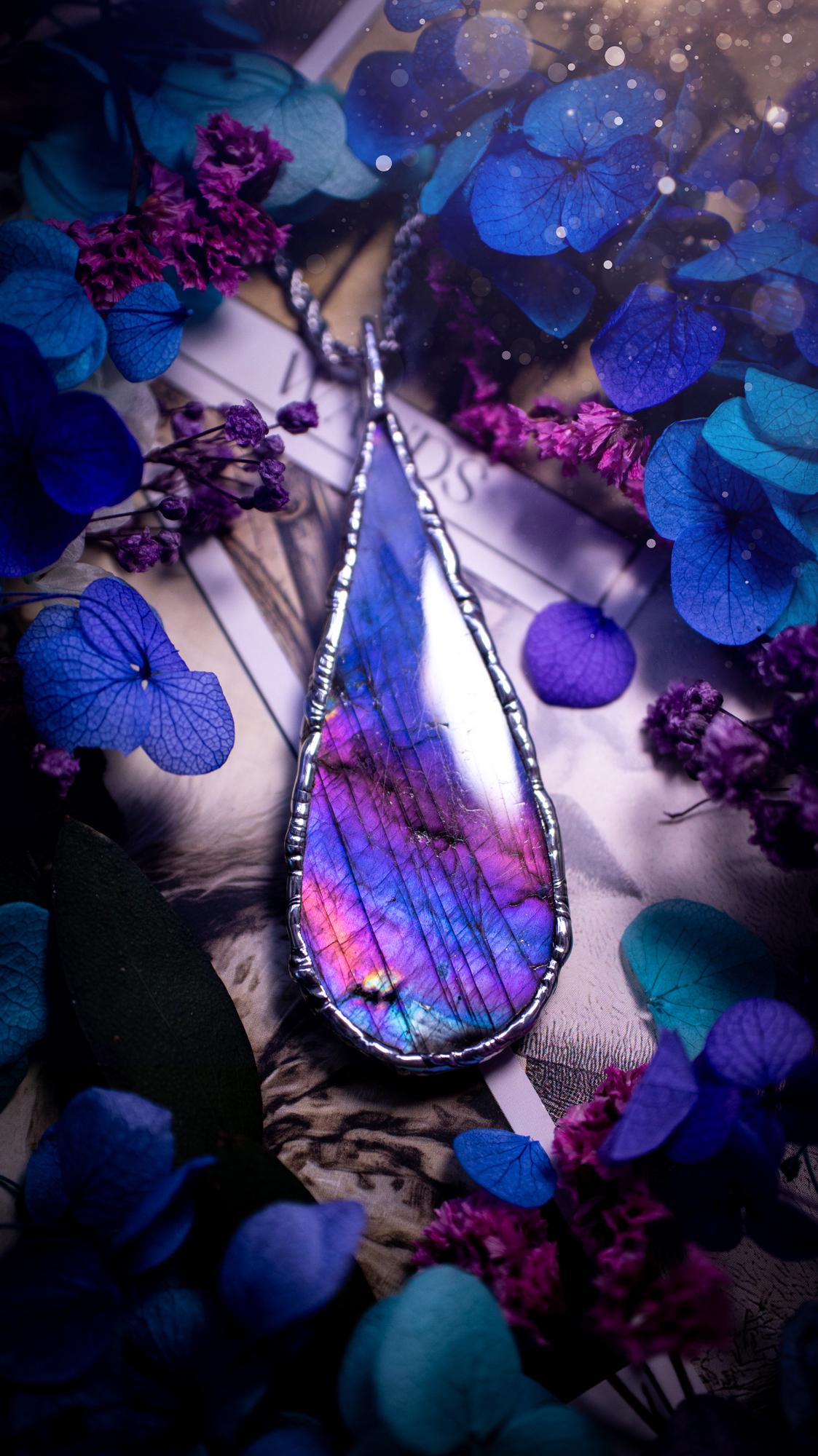 Beautiful and bold, soft soldered, large and very unique Labradorite pendant necklace. This pendant necklace has been handmade using the soft solder method, using lead free solder that contains silver and polished to a high lustre. Featuring a large, very pretty statement Labradorite crystal that is full of beautiful purples, pinks, and blues, with different flashes from different angles. This piece would but suitable for anyone who loves jewellery, crystals, and a gothic aesthetic.