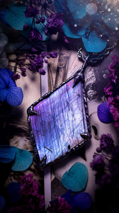 One of a kind, purple pink and blue, soft soldered, Labradorite crystal pendant necklace. This pendant has been made with love and care, handcrafted using the tiffany technique, also known as soft solder method. The crystal has a bezel of solder that contains various metals including silver and is hypoallergenic. Featuring a stunning, natural and unique coloured Labradorite crystal. This jewellery piece is ideal for gifting and for anyone who loves crystals and jewellery with a gothic vibe.