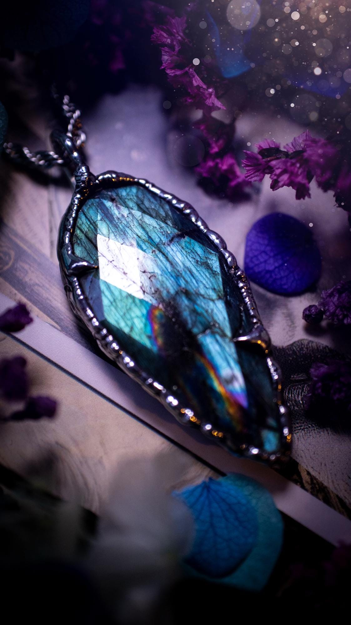 One of a kind, teal green and rainbow, soft soldered, Labradorite crystal pendant necklace. This pendant has been made with love and care, handcrafted using the tiffany technique, also known as soft solder method. The crystal has a bezel of solder that contains various metals including silver and is hypoallergenic. Featuring a stunning, natural and unique coloured Labradorite crystal. This jewellery piece is ideal for gifting and for anyone who loves crystals and jewellery with a gothic vibe.