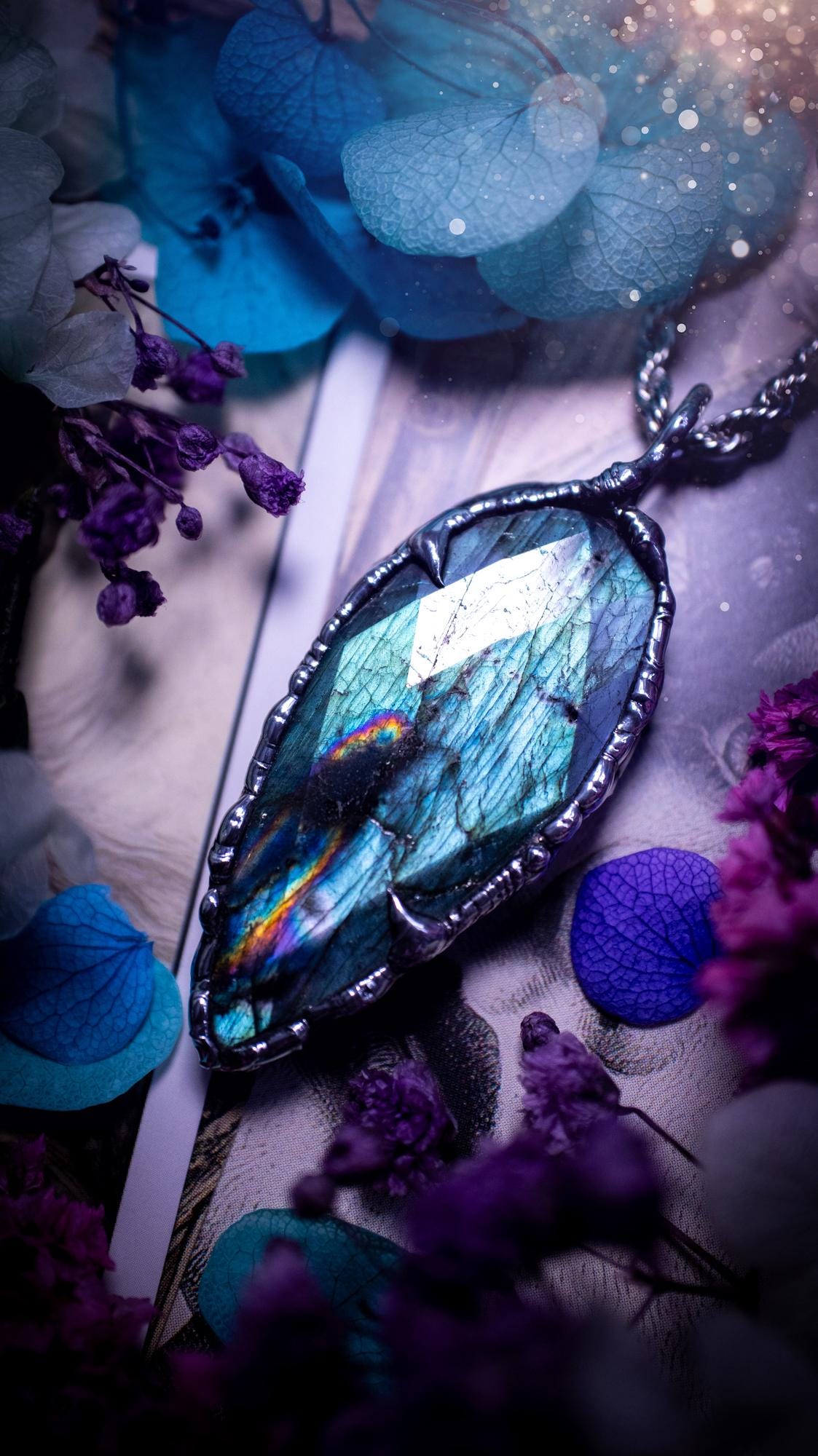 One of a kind, teal green and rainbow, soft soldered, Labradorite crystal pendant necklace. This pendant has been made with love and care, handcrafted using the tiffany technique, also known as soft solder method. The crystal has a bezel of solder that contains various metals including silver and is hypoallergenic. Featuring a stunning, natural and unique coloured Labradorite crystal. This jewellery piece is ideal for gifting and for anyone who loves crystals and jewellery with a gothic vibe.