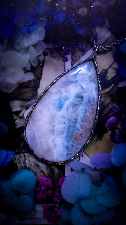 One of a kind, large, soft soldered, Larimar crystal pendant necklace. This pendant has been made with love and care, handcrafted using the tiffany technique, also known as soft solder method. The crystal has a bezel of solder that contains various metals including silver and is hypoallergenic. Featuring a stunning, natural and unique coloured Larimar crystal. This jewellery piece is ideal for gifting and for anyone who loves crystals and jewellery with a gothic vibe.