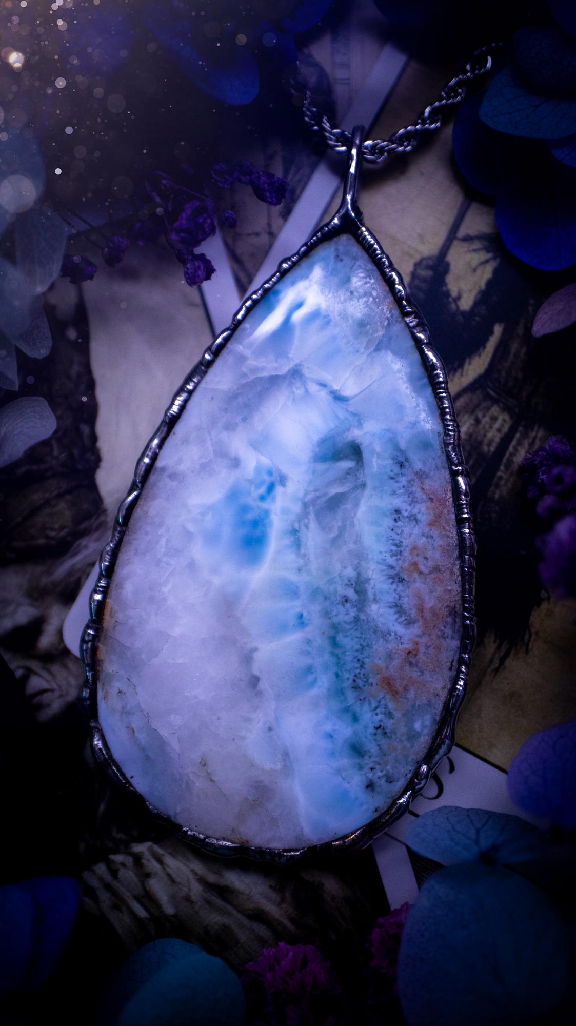 One of a kind, large, soft soldered, Larimar crystal pendant necklace. This pendant has been made with love and care, handcrafted using the tiffany technique, also known as soft solder method. The crystal has a bezel of solder that contains various metals including silver and is hypoallergenic. Featuring a stunning, natural and unique coloured Larimar crystal. This jewellery piece is ideal for gifting and for anyone who loves crystals and jewellery with a gothic vibe.