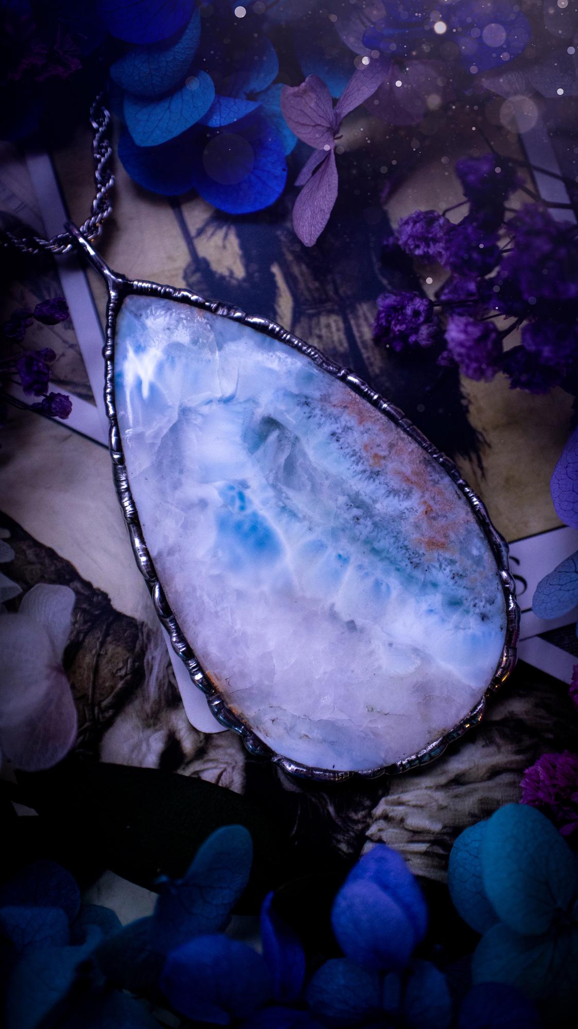 One of a kind, large, soft soldered, Larimar crystal pendant necklace. This pendant has been made with love and care, handcrafted using the tiffany technique, also known as soft solder method. The crystal has a bezel of solder that contains various metals including silver and is hypoallergenic. Featuring a stunning, natural and unique coloured Larimar crystal. This jewellery piece is ideal for gifting and for anyone who loves crystals and jewellery with a gothic vibe.