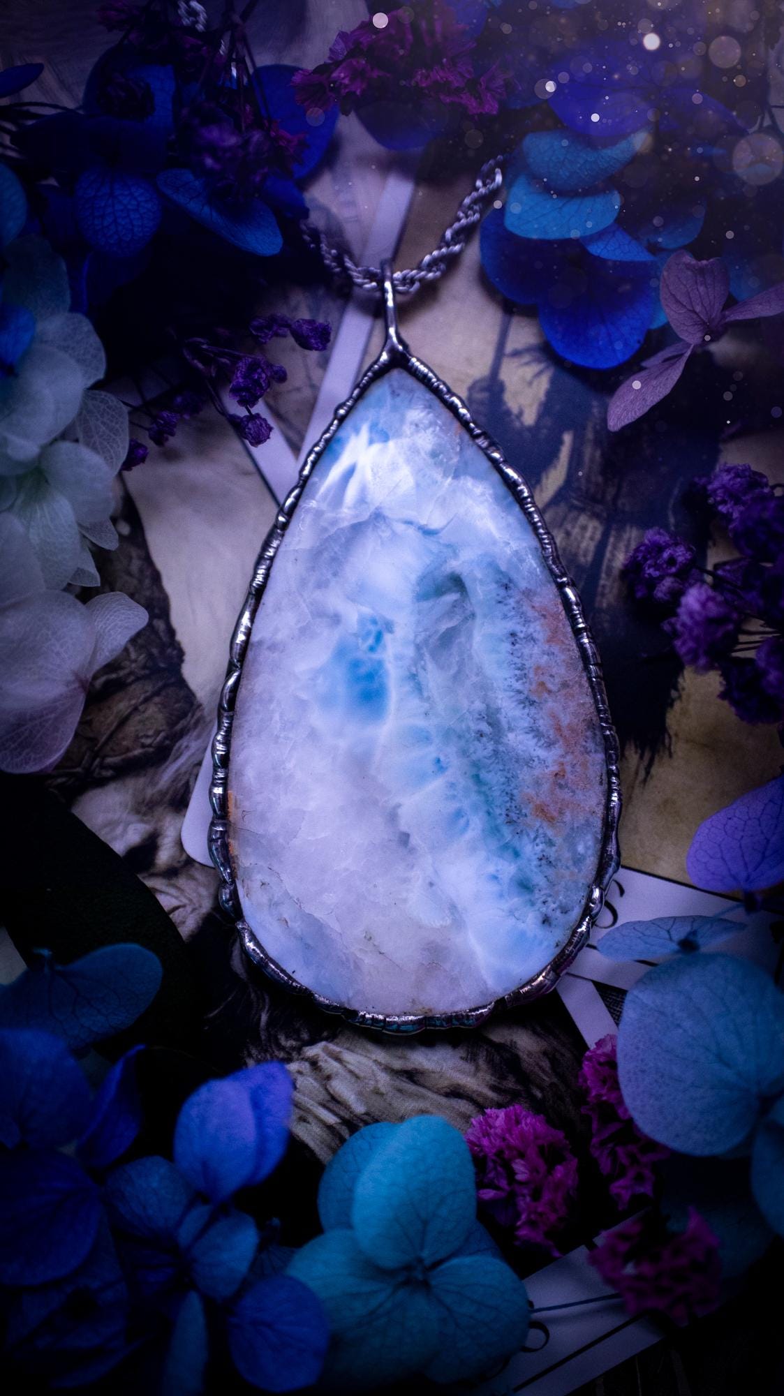 One of a kind, large, soft soldered, Larimar crystal pendant necklace. This pendant has been made with love and care, handcrafted using the tiffany technique, also known as soft solder method. The crystal has a bezel of solder that contains various metals including silver and is hypoallergenic. Featuring a stunning, natural and unique coloured Larimar crystal. This jewellery piece is ideal for gifting and for anyone who loves crystals and jewellery with a gothic vibe.