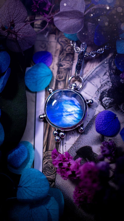Beautifully handmade, high grade, rainbow moonstone, crystal pendant necklace. This one of a kind necklace features a beautiful, very high grade flashy blue rainbow moonstone. Handcrafted using a mix of fine and sterling silver, with pretty little ball accents and a stamped patterned bail. This cute little jewellery piece is ideal for anyone who loves crystals and jewellery. A one off piece with no other being the same, ideal for gifting for any occasion.