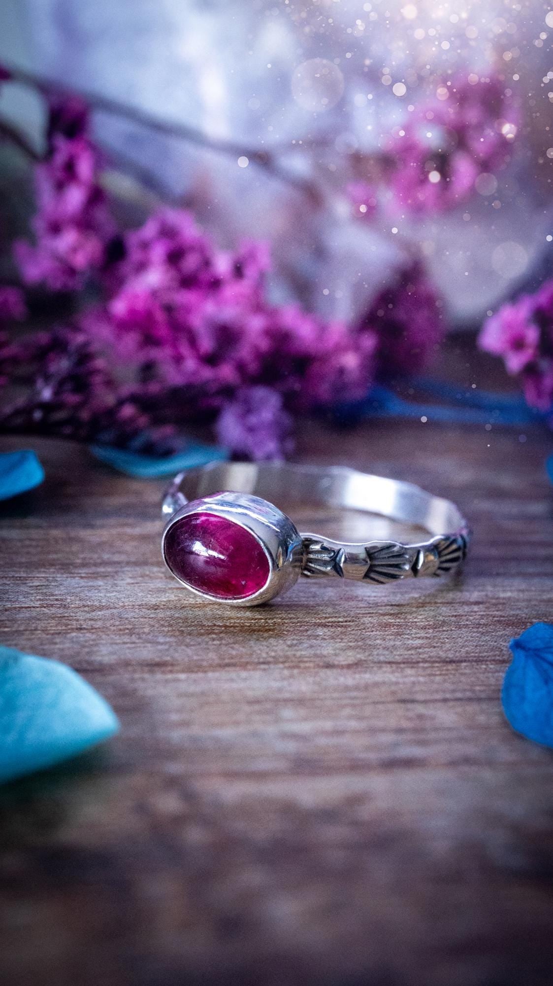 Dainty pink tourmaline stacker ring with a small gemmy natural pink tourmaline gemstone set on a patterned sterling silver band. Handmade with care, this delicate stacking ring features a subtle textured design, perfect for everyday wear or layering with other rings. Feminine and elegant, this minimalist gemstone ring makes a beautiful October birthstone gift or a meaningful addition to any jewellery collection, ideal for lovers of dainty, handmade silver jewellery.