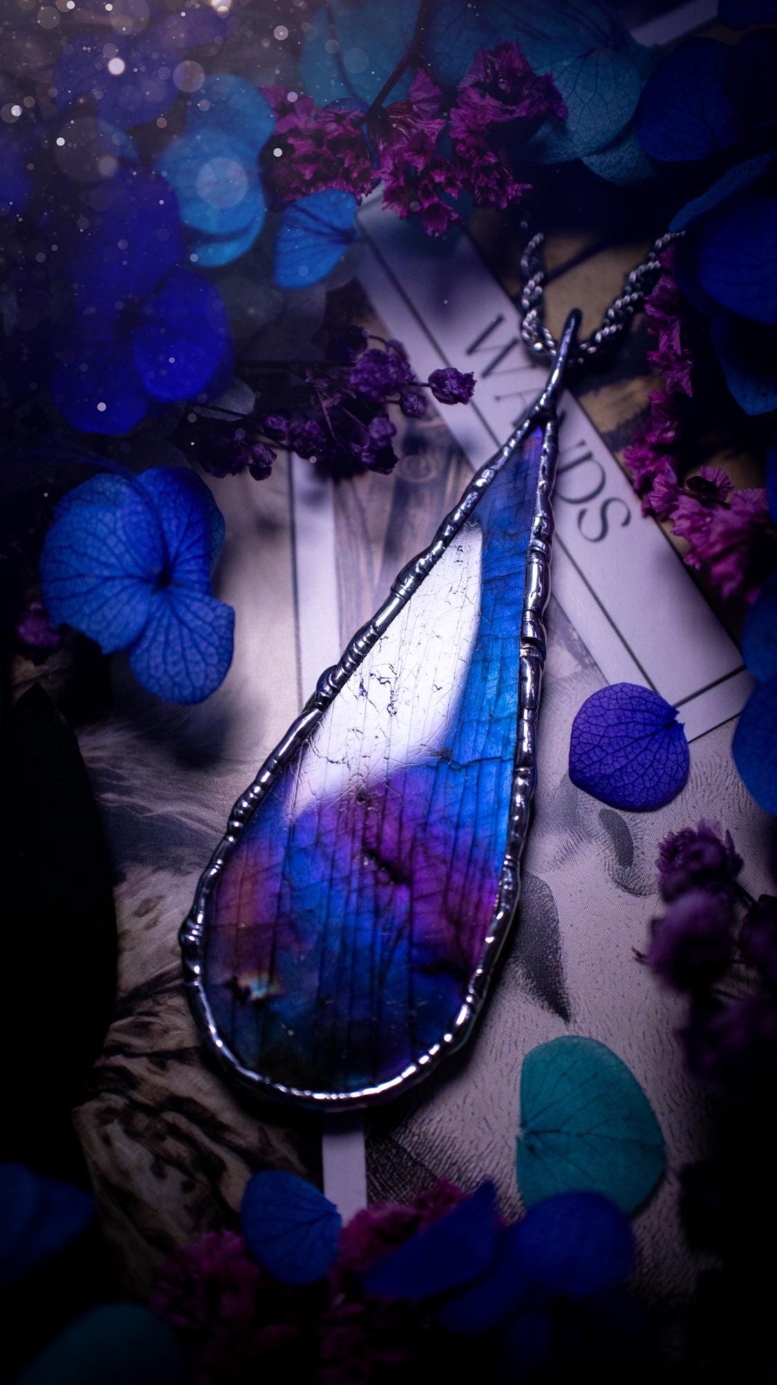 Beautiful and bold, soft soldered, large and very unique Labradorite pendant necklace. This pendant necklace has been handmade using the soft solder method, using lead free solder that contains silver and polished to a high lustre. Featuring a large, very pretty statement Labradorite crystal that is full of beautiful purples, pinks, and blues, with different flashes from different angles. This piece would but suitable for anyone who loves jewellery, crystals, and a gothic aesthetic.