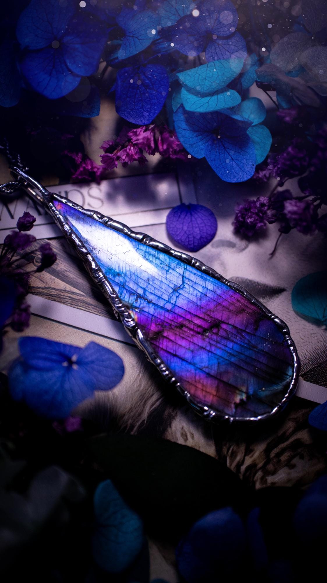 Beautiful and bold, soft soldered, large and very unique Labradorite pendant necklace. This pendant necklace has been handmade using the soft solder method, using lead free solder that contains silver and polished to a high lustre. Featuring a large, very pretty statement Labradorite crystal that is full of beautiful purples, pinks, and blues, with different flashes from different angles. This piece would but suitable for anyone who loves jewellery, crystals, and a gothic aesthetic.
